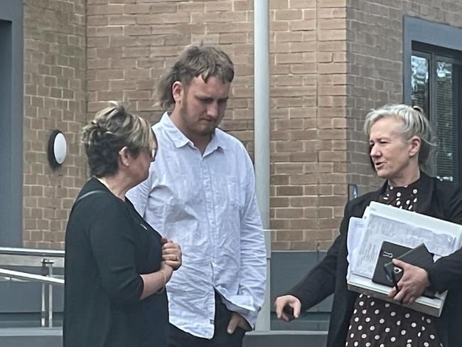 Hancock (middle) talks to his lawyer Natasha Konic (right) outside court. Picture: NewsLocal