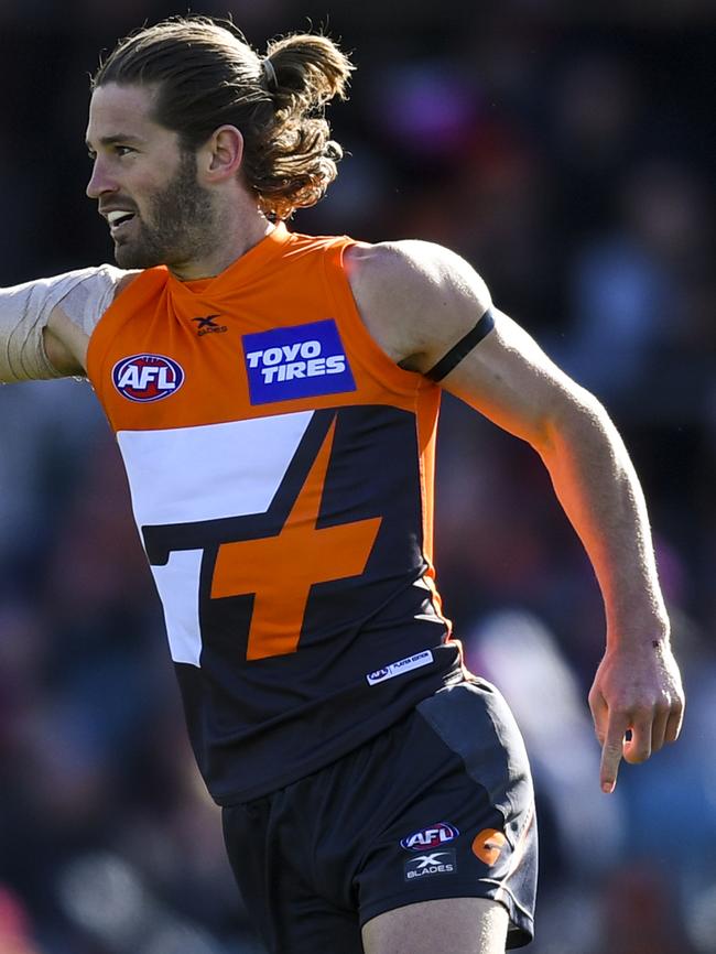 Callan Ward celebrates a goal against Melbourne.