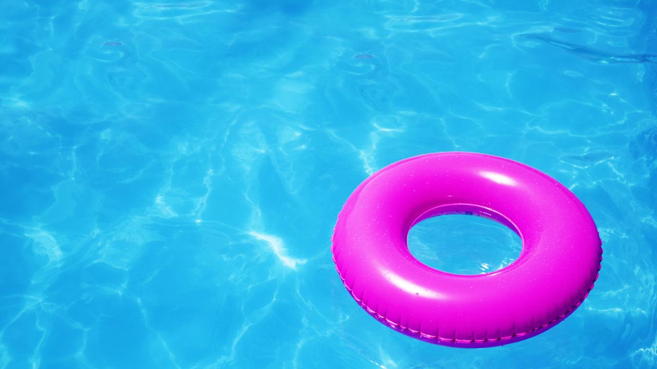 Pink pool float in a refreshing blue swimming pool