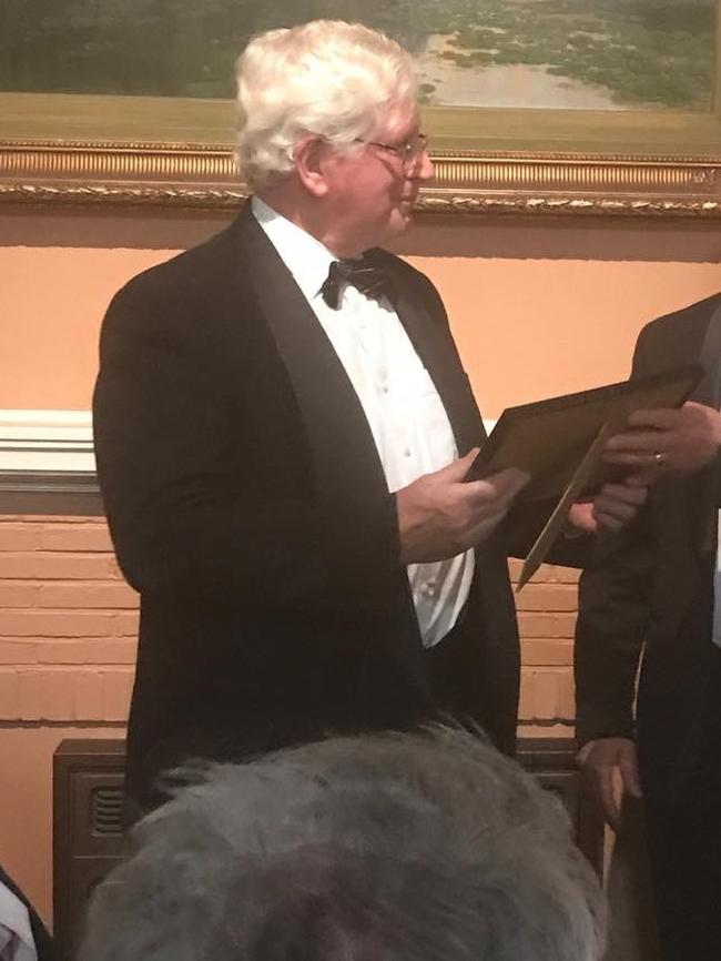 Michael John Wisby receiving his life membership to the Tasmanian branch of the exclusive Carbine Club in 2017. He's now pleaded guilty to ripping off well in excess of $100,000 from the club's coffers while he worked as its treasurer. Picture: Instagram