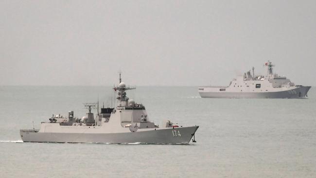 A Chinese PLA-N Luyang-class guided missile destroyer, left, and a PLA-N Yuzhao-class amphibious transport dock vessel leaving the Torres Strait and entering the Coral Sea on Fridyay. Picture: AFP