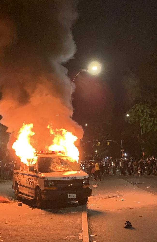 In Brooklyn, New York, rioters rocked an NYPD van and then set it alight in one of many clashes across the borough.