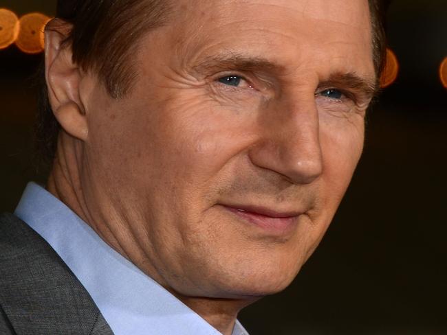 (FILES) In this file photo taken on February 24, 2014 Liam Neeson poses on arrival for the world premiere of the film "Non-Stop" in Los Angeles, California. - Hollywood star Liam Neeson insisted on February 5, 2019 he was "not racist" after confessing that he once set out to attack a random black man after a friend of his told him she had been raped. "I'm not a racist," Neeson said on ABC News, although he admitted he had felt a "primal urge to lash out" about 40 years ago after hearing from his close friend that she had been raped by a black man. (Photo by Frederic J. BROWN / AFP)