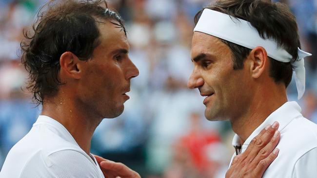 Switzerland’s Roger Federer (right) embraces Spains Rafael Nadal after their men’s singles semi-final at Wimbledon. Picture: AFP