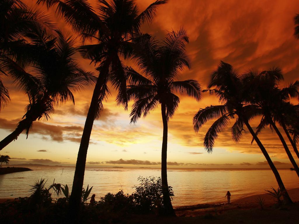 ESCAPE: FIJI -  Palm trees are seen as the sun set over Nadi Bay in Vuda Point, Lautoka, Fiji. Picture: Istock