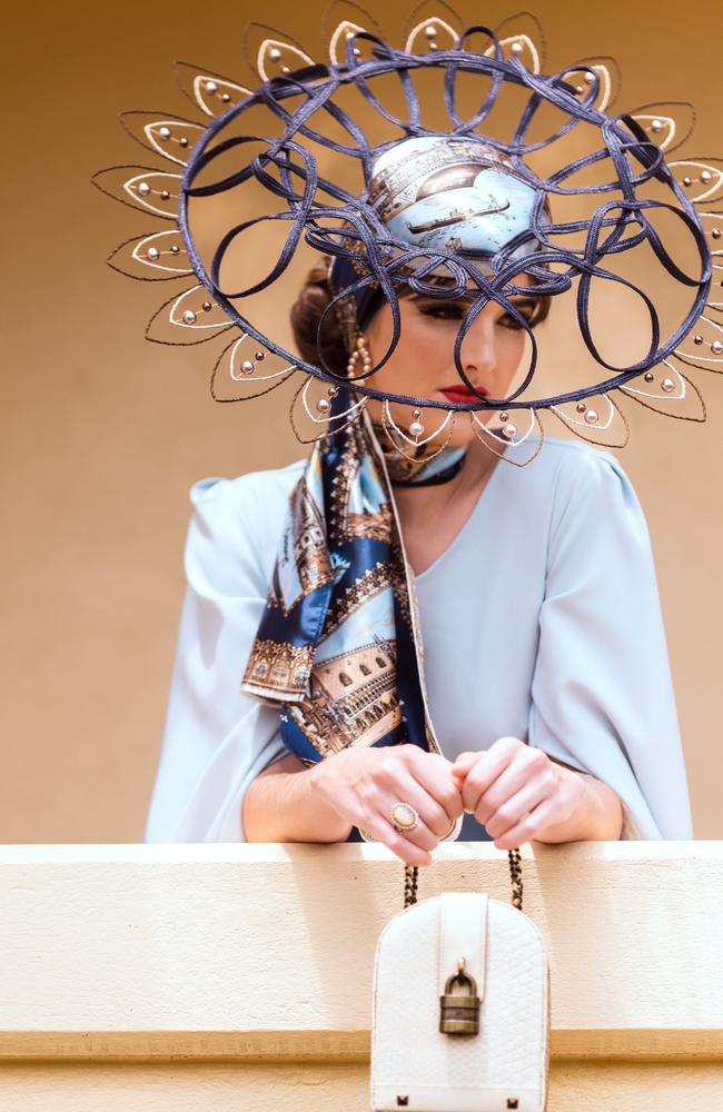 Audrey Anwyl models an outfit by Mareeba's Sonlia Fashions. The fascinator has made it into the finals for Myer’s fashion on the field millinery category. Picture: Nuno Avendano