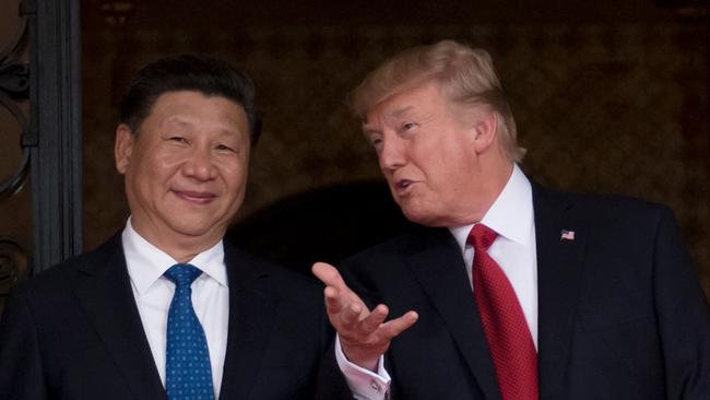 Donald Trump welcomes Xi Jinping to Mar-a-Lago in 2017. (Photo by JIM WATSON / AFP)