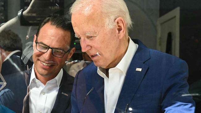 US President Joe Biden visits a coffee shop with Pennsylvania Governor Josh Shapiro.