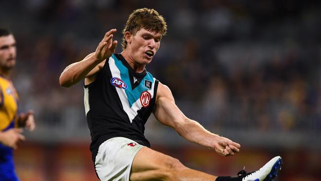 PERTH, AUSTRALIA – APRIL 03: Mitch Georgiades of the Power kicks the ball during the 2021 AFL Round 03 match between the West Coast Eagles and the Port Adelaide Power at Optus Stadium on April 03, 2021 in Perth, Australia. (Photo by Daniel Carson/AFL Photos via Getty Images)