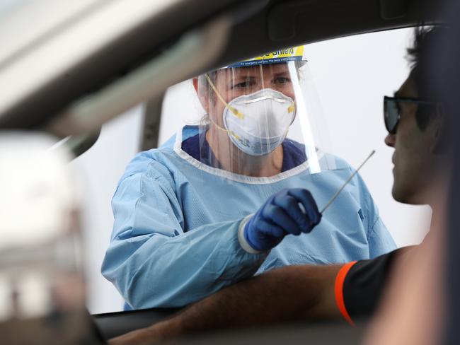 Ms Macfarlane conducts a swab test at the drive-through clinic earlier this year. Pic: John Feder