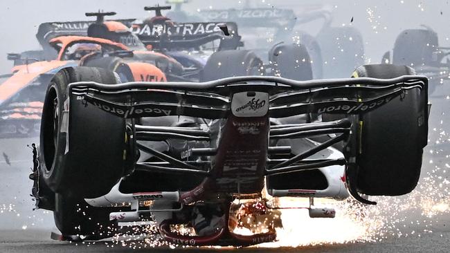 Zhou Guanyu skids across the track upside down in his horror crash. Picture: Ben Stansall/AFP