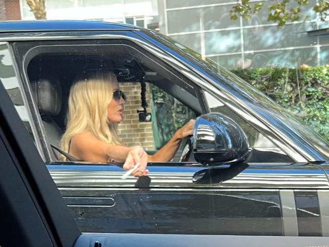 Jackie O puffed on a cigarette as she drove to Fashion Week on Tuesday morning. Picture: The Daily Telegraph