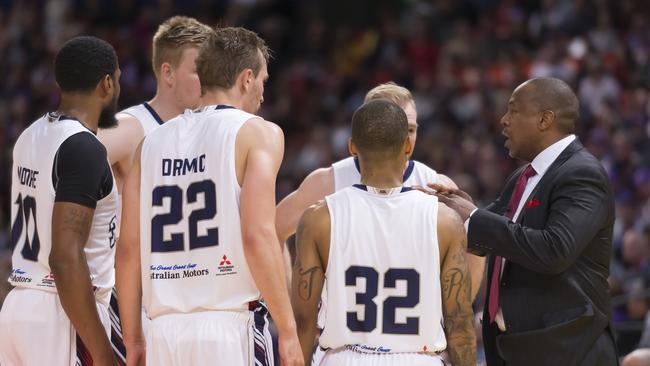 Coach Joey Wright speaks with his players during Adelaide 36ers’ loss to Sydney Kings on Saturday night. Picture: Craig Golding (AAP).