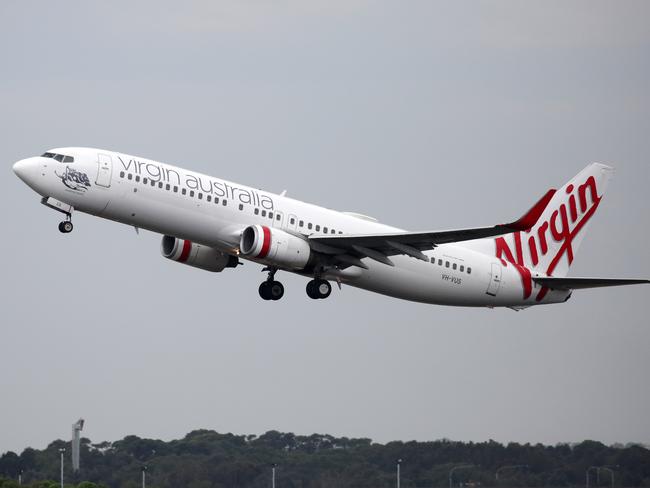 SYDNEY, AUSTRALIA - NewsWire Photos OCTOBER 08, 2020 - A Virgin Australia plane takes off at Sydney Airport on Thursday October 08, 2020.Picture: NCA NewsWire / Christian Gilles
