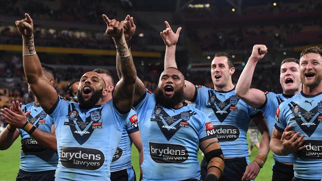 Blues players celebrate their series-clinching victory in Brisbane.