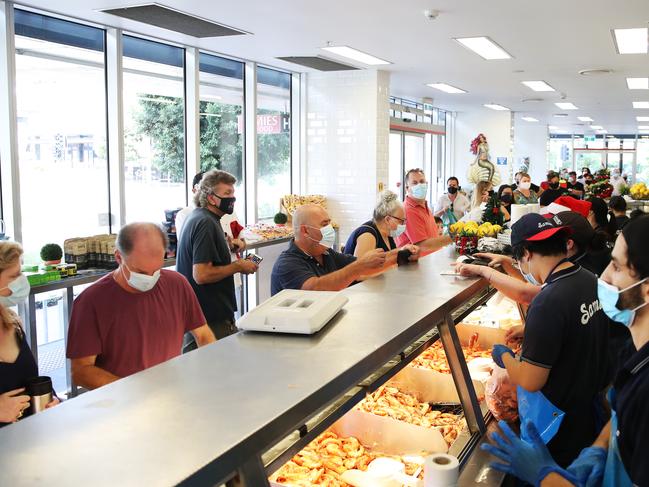 People line up to get Christmas Seafood from Samies Seafood in Hamilton.  Picture: Zak Simmonds