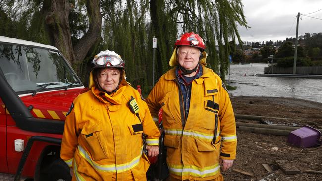 Firefighter Bindy-Ann Daniels firefighter and brigade chief Bill Rye who have been door knocking residents in the Derwent Valley and patrolling flood waters. Lachlan Fire Brigade members patrolling flood waters from the Derwent River at New Norfolk. Picture: Nikki Davis-Jones