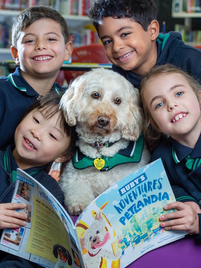 Adam, Leonardo and Yolanda Yu, all 6, with Chloe, 7, and Ruby the labradoodle. Picture: Jay Town