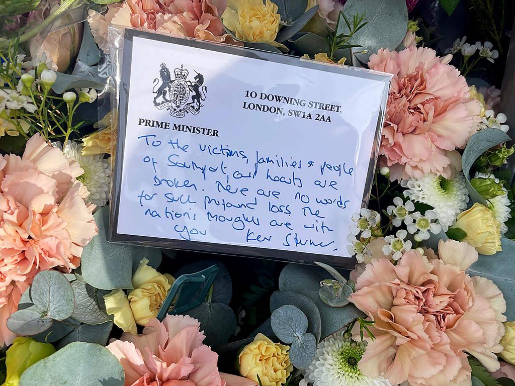 A floral tribute with a message from Britain's Prime Minister Keir Starmer. Picture: AFP