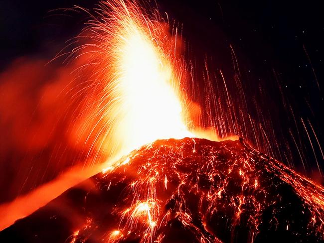 epa07176449 Volcan de Fuego (Volcano of Fire) mount spews hot ashes and lava, as seen from Alotenango, Guatemala, 18 November 2018 (issued on 19 November 2018). The volcano has erupted for fifth time this year, according to Guatemalan Seismology, Vulcanology, Meteorology Institute. According to experts, the volcano expels a column of ashes reaching 4,900 metres above sea level and 4 km-wide moving to southeast and west of the mount 50 km off Guatemalan capital. The residents of Sangre de Cristo community began to be evacuated due to volcano activity.  EPA/ESTEBAN BIBA