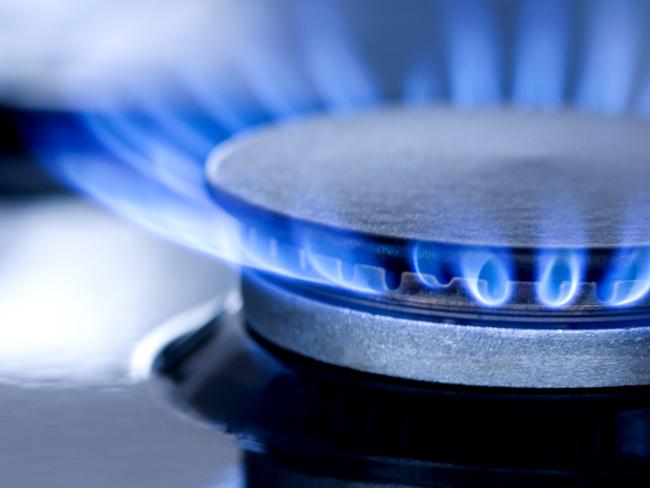 Blue flames from gas stove burner. Closeup shot of blue flames from a kitchen gas range.