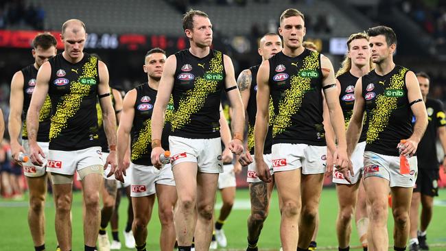 Richmond defender Dylan Grimes and Tylar Young leading the Tigers off the ground on Monday night. Picture: Picture: Quinn Rooney/Getty Images