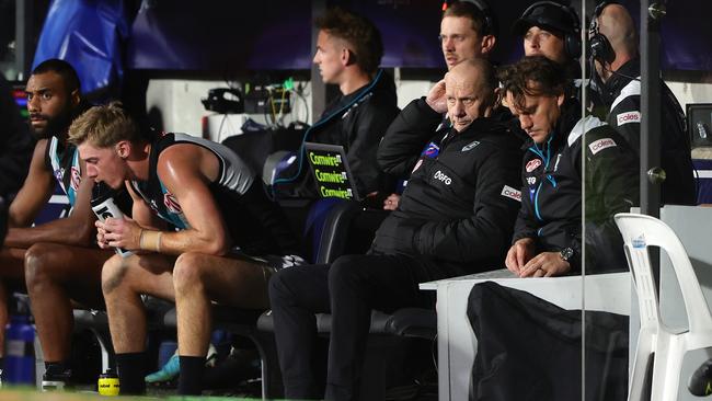 Port Adelaide’s Jackson Mead (middle) sits at the back of the interchange bench after being the Power’s substitute in Showdown 55 at Adelaide Oval. Picture: Sarah Reed/AFL Photos via Getty Images