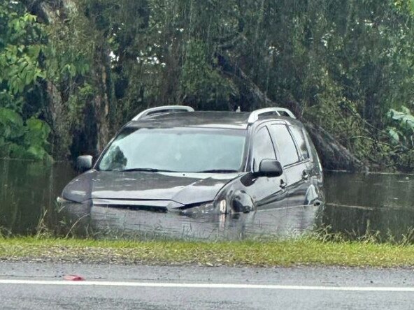 A car in floodwaters on North Stradbroke Island. Picture: Facebook