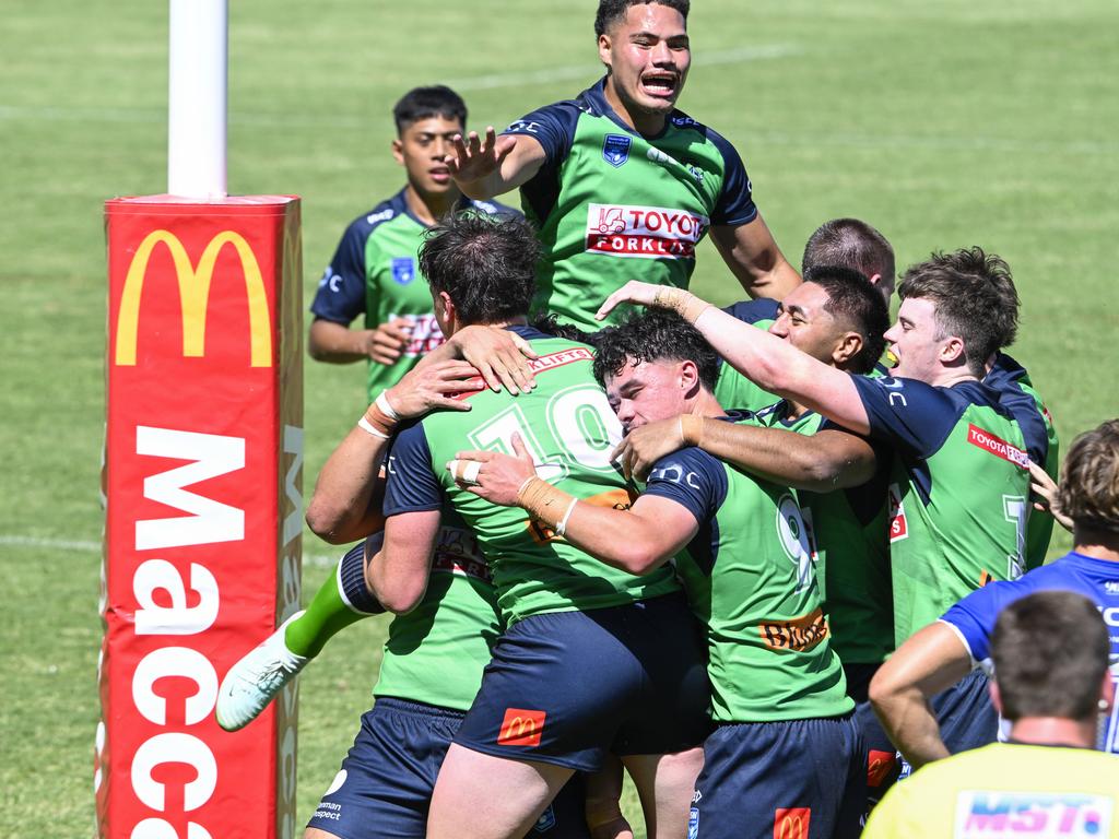 Canberra celebrates a try. Picture: Martin Ollman