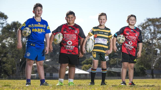 Junior Rugby League players Josh Savins,8, Jayden Tatafu, 8, Logan Webb, 8, and Vasili Soteriou, 7. Picture: Dylan Robinson