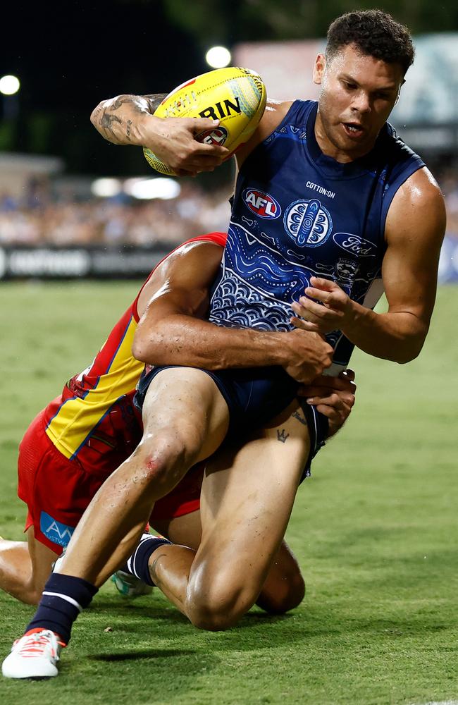 Brandan Parfitt of the Cats is tackled during Round 10 at TIO Stadium. Picture: Michael Willson/AFL Photos via Getty Images.