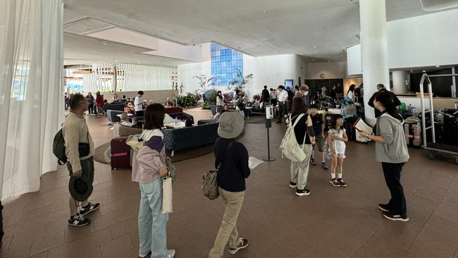 The foyer of Hilton Cairns on the Esplanade was a hive of activity as it accommodated the evacuees after a helicopter crashed into sister hotel, DoubleTree by Hilton on Monday, August 12. Picture: Arun Singh Mann