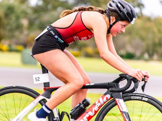 Deja, 17, (no surname) training for a triathlon. Picture: Hunter Wood Photography