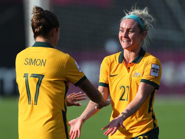 MUMBAI, INDIA - JANUARY 21: Ellie Carpenter (R) of Australia celebrates scoring her side's tenth goal with her team mate Kyah Simon (L) during the AFC Women's Asian Cup Group B match between Australia and Indonesia at Mumbai Football Arena on January 21, 2022 in Mumbai, India. (Photo by Thananuwat Srirasant/Getty Images)