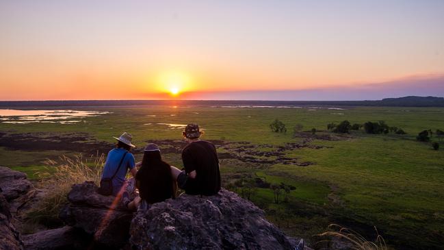 The NT’s tourism and hospitality sectors have welcomed the Government’s Time To Be A Territorian campaign, but it is what comes next that matters most to them. Pictured are tourists at Ubirr, Kakadu National Park. Picture: Johan Lolos/Tourism NT