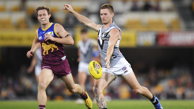 Kane Farrell uses his elite left-foot in the Round 5 clash with the Lions. Picture: Albert Perez/Getty Images