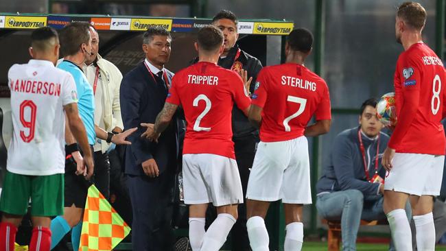 Raheem Sterling, Kieran Trippier and Jordan Henderson speak with Krasimir Balakov manager of Bulgaria during the UEFA Euro 2020 qualifier in Sofia Picture: Getty Images