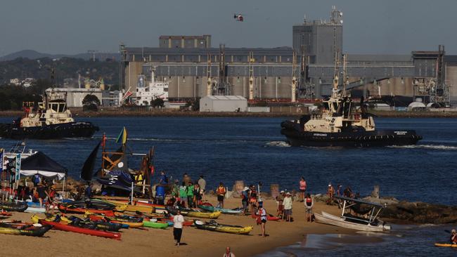 Protesters prepare to paddle out into the Port of Newcastle. Picture: NewsWire/Dean Sewell.