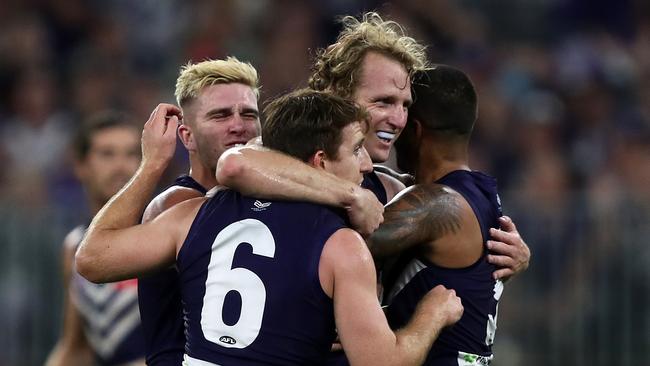 David Mundy of the Dockers celebrates kicking a goal with Reece Conca during the Round 6 AFL match between the Fremantle Dockers and the Western Bulldogs  at Optus Stadium in Perth, Saturday, April 27, 2019.  (AAP Image/Gary Day) NO ARCHIVING, EDITORIAL USE ONLY