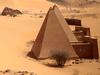 This Thursday, April 16, 2015 photo, shows a general view of the historic Meroe pyramids site, in al-Bagrawiya, 200 kilometers (125 miles) north of Khartoum, Sudan. The steep, small pyramids rise over the desert hills, a stunning reminder of the ancient Nubian kingdom that once ruled Egypt _ and ones not nearly as often visited those of its neighbor. (AP Photo/Mosa'ab Elshamy)