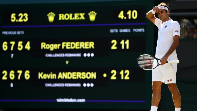 Roger Federer wipes his forehead deep into his loss to South Africa’s Kevin Anderson. Picture: Getty Images.