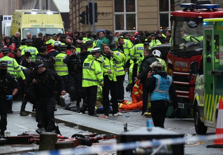 Football unites after car ploughs into Liverpool victory crowd
