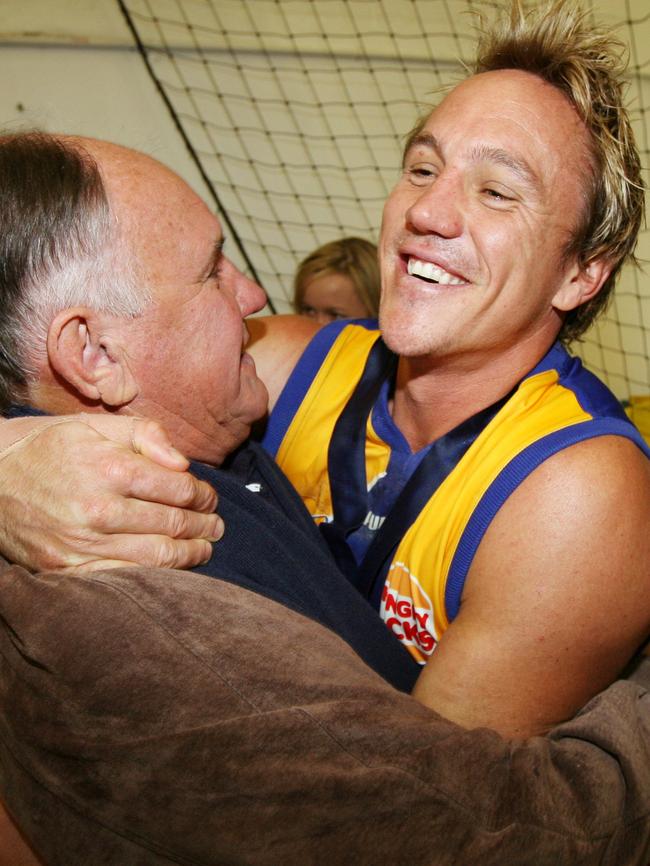 Chick hugs his dad in the rooms after the 2006 Premiership.