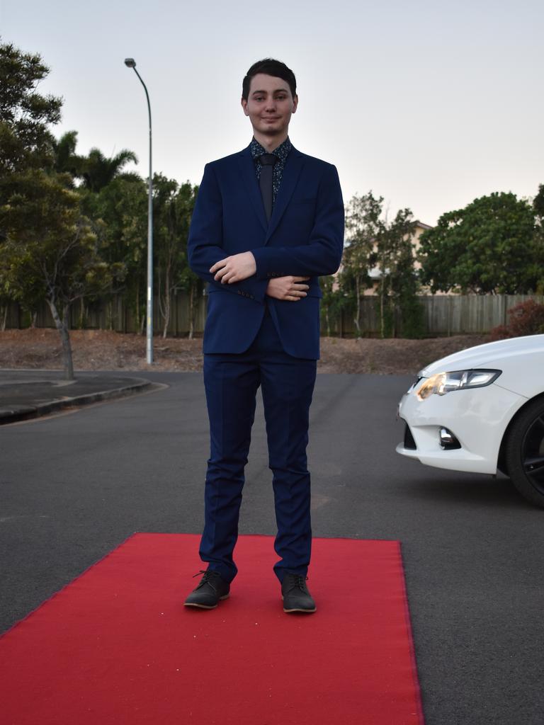 RIVERSIDE FORMAL: Dylan Dunlop stands proud on the red carpet at the Riverside Christian College Formal. Photo: Stuart Fast