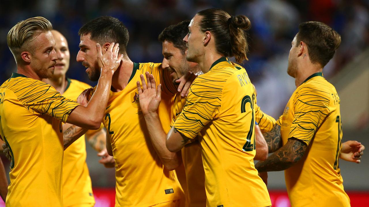 Celebrations all around as the Socceroos soared to a 3-0 first-half lead. (Photo by Tom Dulat/Getty Images)