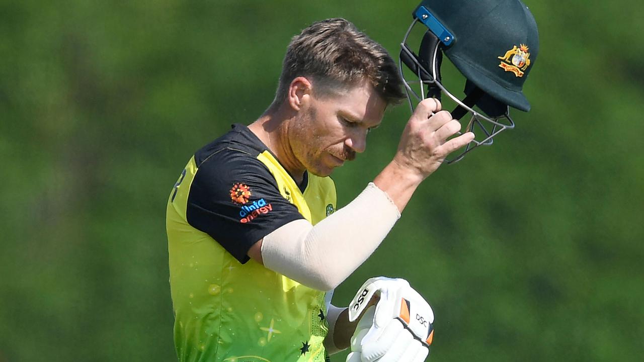 Australia's David Warner walks back to pavilion after his dismissal during the warmup cricket match between India and Australia for the ICC men's Twenty20 World Cup at the ICC Cricket Academy Ground in Dubai on October 20, 2021. (Photo by Aamir QURESHI / AFP)