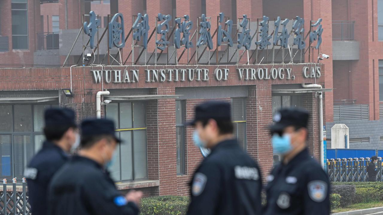 Security personnel stand guard outside the Wuhan Institute of Virology. Picture: Hector Retamal/AFP