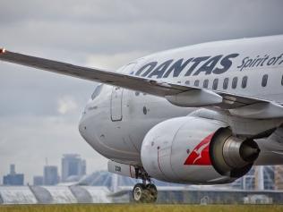 Sydney,Australia - February 20, 2016: A QANTAS Boeing 737 taxies towards the terminal after landing at the city's airport. QANTAS is the flag carrier for Australia.