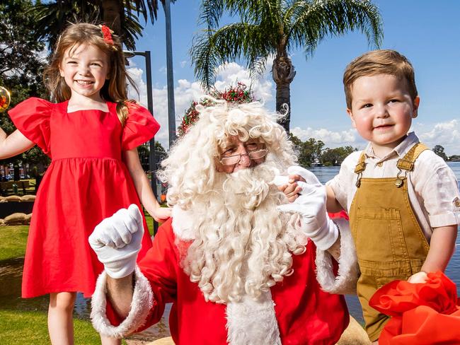 Portia, 4, and Hugo, 2, with Santa at the Port of Renmark  on December 22nd, 2022, in Renmark.Picture: Tom Huntley