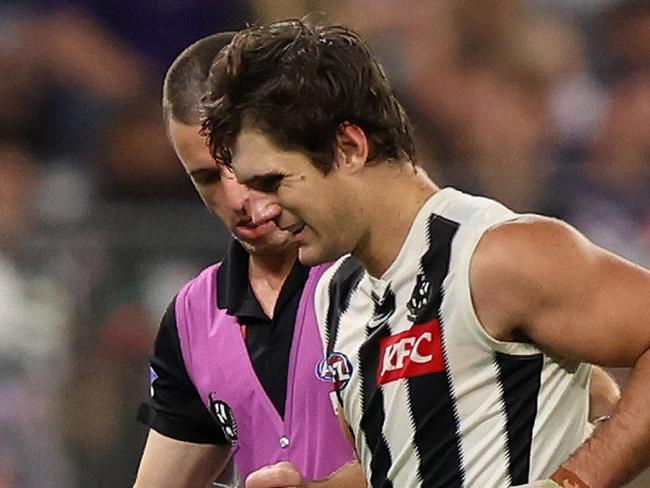 PERTH, AUSTRALIA - MAY 08: Lachie Schultz of the Magpies leaves the field injured during the 2025 AFL Round 09 match between the Fremantle Dockers and the Collingwood Magpies at Optus Stadium on May 8, 2025 in Perth, Australia. (Photo by Janelle St Pierre/AFL Photos via Getty Images)